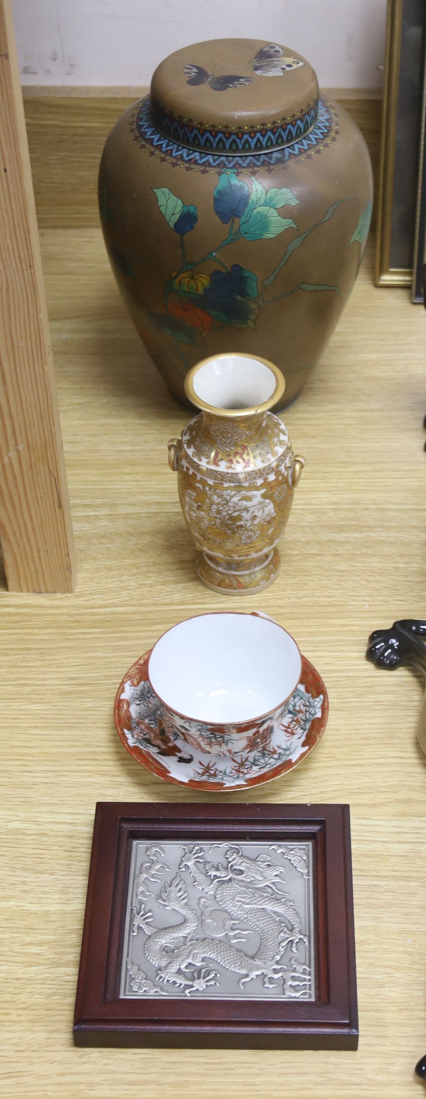 A jar and cover, height 26cm, a Satsuma vase, a cup and saucer and a tile